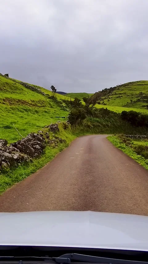 Car POV Driving Through Rolling Green Countryside On Flores Island Portugal Stock Footage 337636320