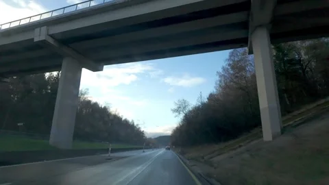 Car POV Driving Under Overpass on European Autobahn in Autumn Stock Footage 331947897