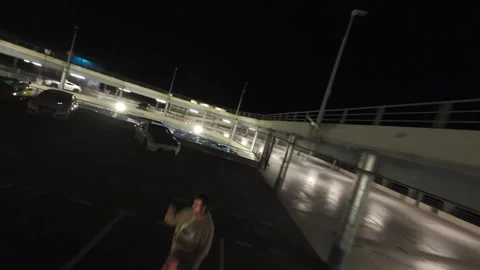 Car POV drone inside circular parking at night Vídeos de archivo 345258871