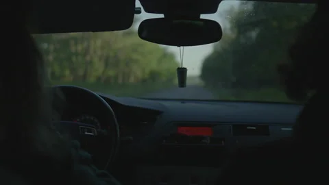 Car POV on tree-lined road with seats Video stock 345717608