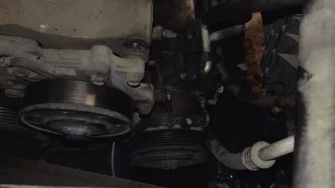 A car power steering pump or air conditioning compressor Vídeo Stock 339493210