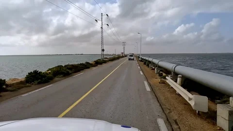 Car process plate of roman bridge connecting djerba to mainland Stock Footage 280880081