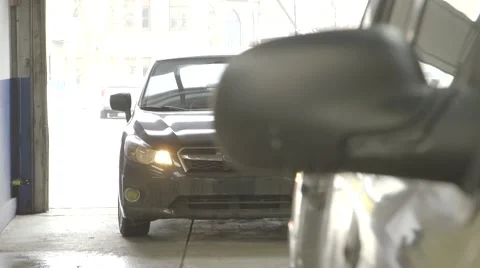 Car pulling into body shop Stock Footage 47674328