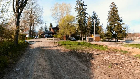 Car Pulling Out on Dirt Road Stock Footage 130063118
