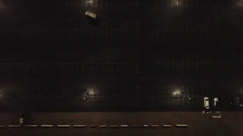 Car Pulling Out of a Mostly Empty Parking Lot Vídeos de archivo 233986083