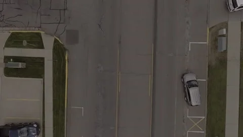 Car Pulling out of Parking Space Overhead Stock Footage 145235949