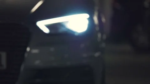 Car Pulls Up and Backs Out Flashing its Headlights Stock Footage 81494436