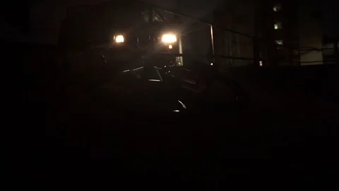 Car pulls up to the fence next to which the bikes lie 스톡 동영상 103044491