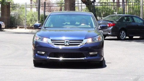 Car pulls into parking space Stock Footage 83369844