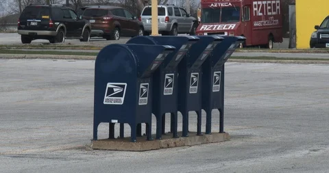 Car Pulls up to a Row of Mailboxes Stock Footage 88840443