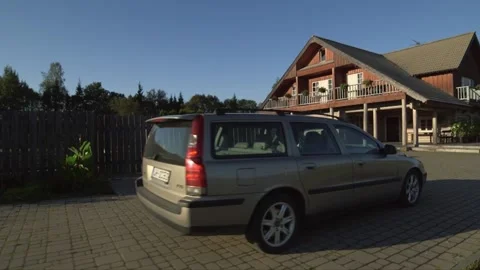 Car pulls up to a rural guest house, restaurant Video stock 238451288