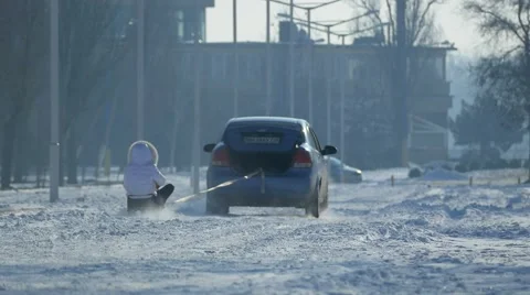 Car pulls the sled. Video stock 59795483