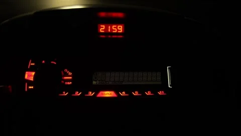 Car radio head unit with glowing red buttons in dark. Stock Footage 331216675