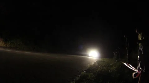 Car rally going with speed on a winding mountain road during a competition 01 Stock Footage 59556168