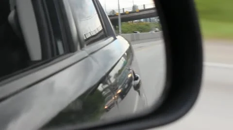Car Rear View Mirror with Freeway Traffic Stock Footage 11067011