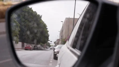Car rearview mirror reflection in slow motion Stock Footage 339959732
