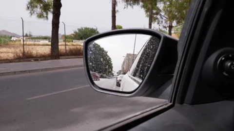Car rearview mirror reflection in slow motion Stock Footage 339959737