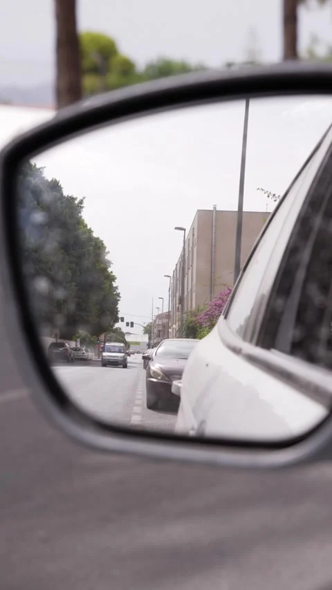 Car rearview mirror reflection in slow motion Stock Footage 339959749