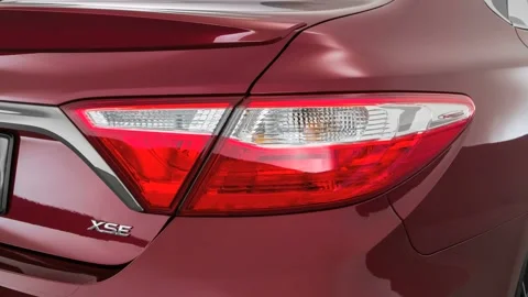 Car red tail light close up Ruby Flare Pearl 2016 Toyota Camry XSE Stock Footage 159851681