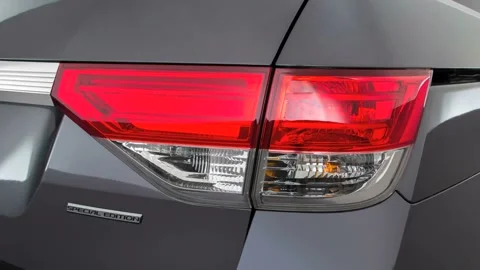 Car red tail light close up Modern Steel Metallic 2016 Honda Odyssey SE Stock Footage 159852688