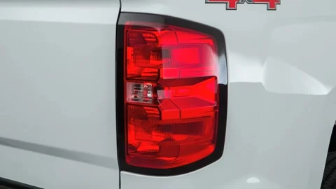 Car red tail light close up Summit White 2016 Chevrolet Silverado 1500 LS Stock Footage 159865754