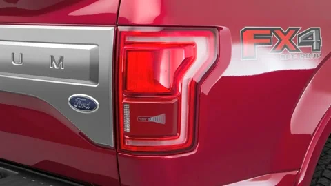 Car red tail light close up Ruby Red Tinted Clearcoat 2016 Ford F-150 Platinum Stock Footage 159866586