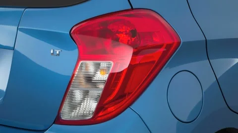 Car red tail light close up Splash Metallic 2016 Chevrolet Spark 1LT Automatic Stock Footage 159868645