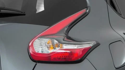 Car red tail light close up Gun Metallic 2016 Nissan Juke SL Stock Footage 159872174