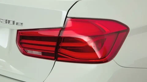 Car red tail light close up Alpine White 2016 BMW 3-series 330e Stock Footage 159883673