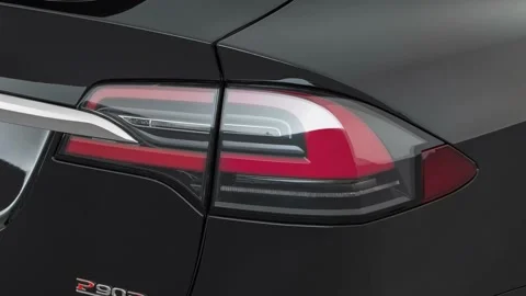 Car red tail light close up Solid Black 2016 Tesla Model X P90D Stock Footage 159889326