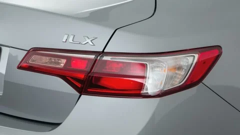 Car red tail light close up Lunar Silver Metallic 2017 Acura ILX Stock Footage 159893386