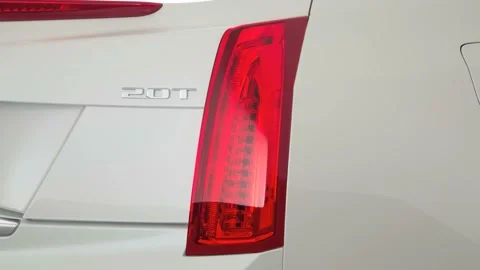 Car red tail light close up Crystal White Tricoat 2017 Cadillac ATS Luxury Stock Footage 159905174