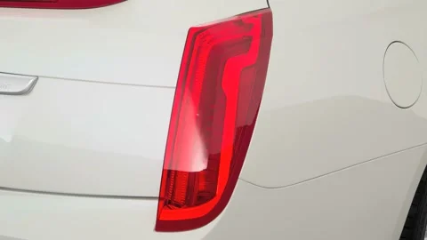 Car red tail light close up Crystal White Tricoat 2017 Cadillac XTS Luxury Stock Footage 159909555