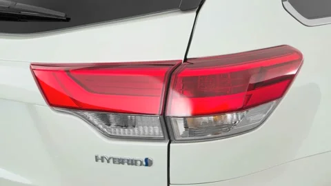 Car red tail light close up Blizzard Pearl 2017 Toyota Highlander Hybrid XLE Stock Footage 159928063