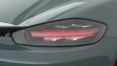 Car red tail light close up Graphite Blue Metallic 2017 Porsche 718 Cayman Stock Footage 159933166