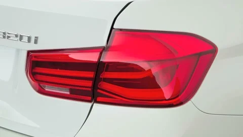 Car red tail light close up Alpine White 2017 BMW 3-series 320i Stock Footage 159933455