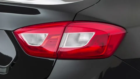 Car red tail light close up Mosaic Black Metallic 2017 Chevrolet Cruze LS Stock Footage 159964123