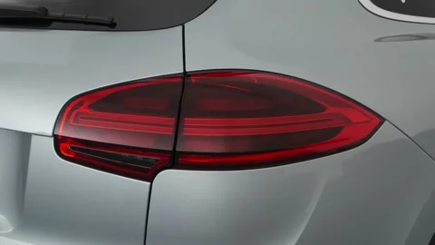 Car red tail light close up Rhodium Silver Metallic 2018 Porsche Cayenne SE Stock Footage 159978836