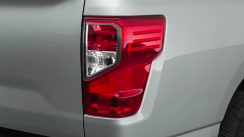 Car red tail light close up Brilliant Silver 2019 Nissan Titan S Stock Footage 160075205