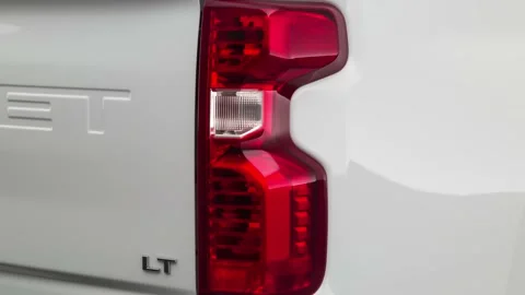Car red tail light close up Summit White 2020 Chevrolet Silverado 2500HD LT Stock Footage 160086229