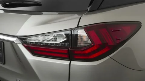 Car red tail light close up Atomic Silver 2020 Lexus RX Hybrid RX 450hL Stock Footage 160091208