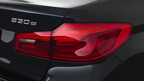 Car red tail light close up Alpine White 2020 BMW 5-series 530e sedan Video stock 160093471