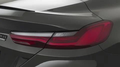 Car red tail light close up Alpine White 2020 BMW M8 Competition coupe Stock Footage 160098034