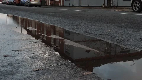 A car reflection in the puddle Stock Footage 229657574