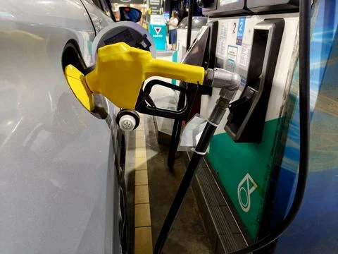 The car is refueling Stock Photos