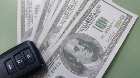 Car remote and banknotes usd, investment or saving, Stock Photos