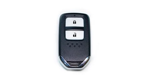 The car remote key has a black frame with 2 keys for Lock and Unlock placed o Stock Photos
