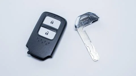 The car remote key has a black frame with 2 keys for Lock and Unlock placed o Stock Photos