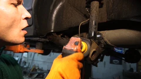 Car repair, installation of rear disc brakes instead of drums locksmith Stock Footage 225699280