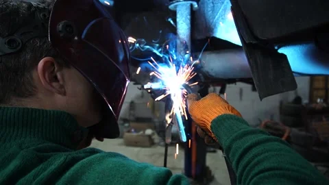 Car repair, installation of rear disc brakes instead of drums welding Stock Footage 225699862